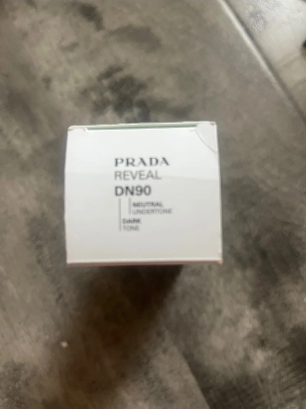 Prada Reveal Ensulizole Sunscreen SPF 17 in White and Gold Accents
